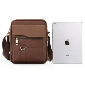 Brown leather messenger bag close-up detail shown with iPad for size reference, retro style.