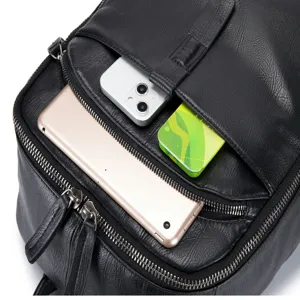 Genuine leather backpack detail showcasing the multi-pocket storage capacity and premium texture.