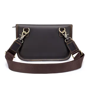 Detail view of men's genuine leather crossbody shoulder bag with adjustable strap and metal hardware.