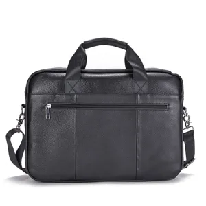 Leather briefcase detail showing textured black finish and zipper pocket for business men.