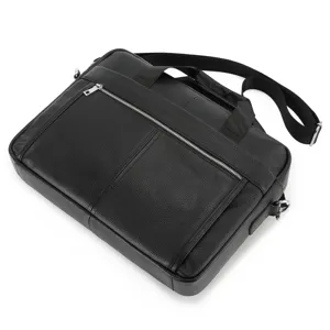 Detailed view of the black genuine leather men business briefcase with metal zippers and strap.
