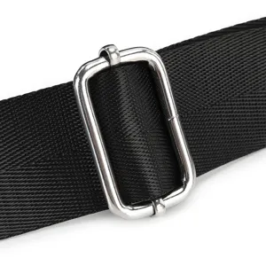 Close-up of black webbing strap with silver metal adjuster buckle for bags accessories detail.