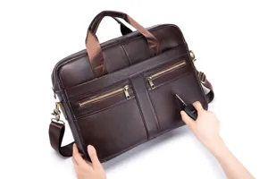 Genuine leather business briefcase detail view showing scratch resistant material and metal zippers