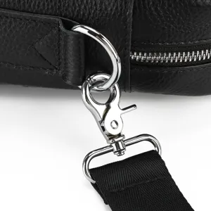 Detailed view of the premium black leather bag hardware, showing metal hook and zipper.