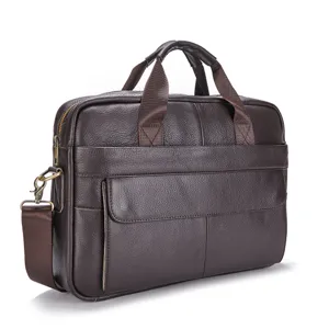 Dark brown leather briefcase detail, metal hardware close-up view showing craftsmanship.