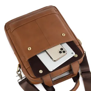 Detail view of genuine leather men messenger bag interior capacity showing tablet and phone.