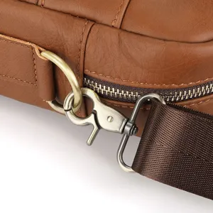 Close-up detail of genuine leather men shoulder bag hardware, metal hook and zipper.