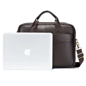 Detail shot of brown leather business briefcase featuring laptop prop showing large capacity.