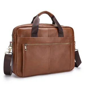 Closeup view of brown leather briefcase showcasing durable metal zippers and premium texture.