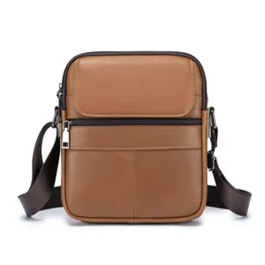 Men brown leather crossbody bag detail, high quality cowhide texture and metal zipper design.