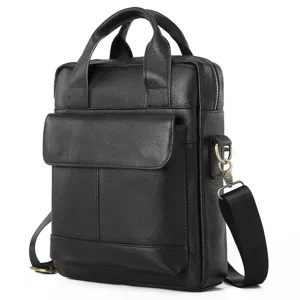 Close-up detail of black genuine leather mens messenger bag with front flap and strap.