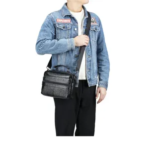 Detail view of black genuine leather men shoulder bag showing multi-pocket design.
