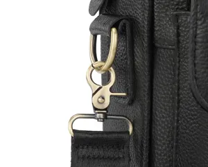 Close-up detail of genuine leather men's bag featuring durable bronze metal hardware and strap.
