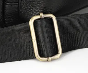 Close-up detail of the durable metal alloy buckle and strong strap on the leather bag.