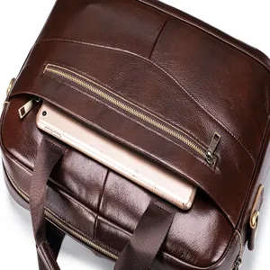Brown leather briefcase detail view, zipper front pocket, vintage business messenger bag for men