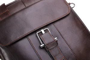 Brown leather men's bag detail shot featuring contrast stitching and silver metal buckle hardware