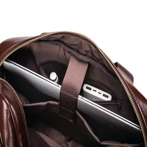 Detailed interior view of men's genuine leather briefcase featuring a padded laptop slot.