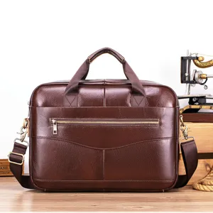Detail view of the brown leather men's business briefcase showing premium texture and strap.