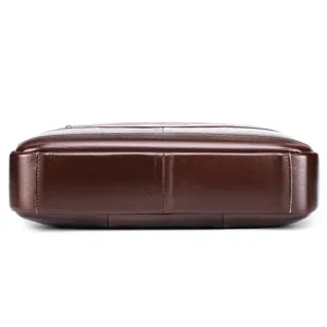 Close-up detail of premium dark brown leather men briefcase showing fine texture and craftsmanship.