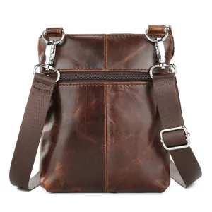 Detailed view of men's genuine leather crossbody bag, brown top grain cowhide with metal hardware.