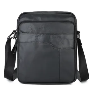 Close-up of black leather men's messenger bag front pocket detail and smooth zipper.