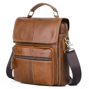 Detailed view of genuine leather men messenger bag with vintage brown finish and sturdy metal hardware.