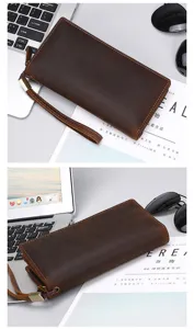 Leather wallet detail showing crazy horse texture, metal zipper and convenient wrist strap.