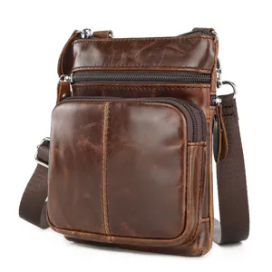 Close-up detail of the genuine leather men's messenger bag showing texture and multi-zipper pocket design.