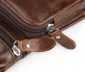 Genuine leather men's messenger bag detail showcasing premium cowhide texture and durable metal zippers.