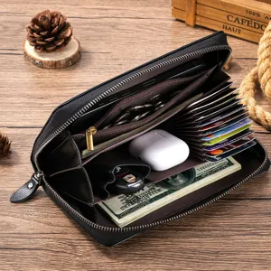 Detailed view of black leather long wallet interior showing multiple card slots and cash compartments.