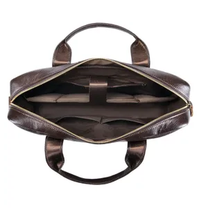 Interior detail view of brown leather business briefcase with multiple compartments.
