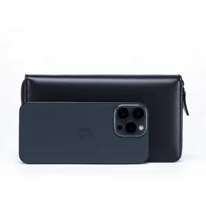 Close-up detail of a black genuine leather men's long wallet with zip-around closure.