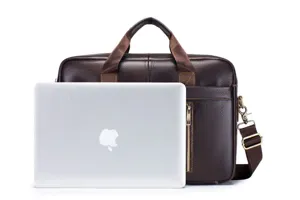 Close-up detail of genuine leather business briefcase with laptop compartment and handles.