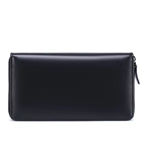 Close-up detail of black leather long wallet zipper coin pocket minimalist design smooth texture.