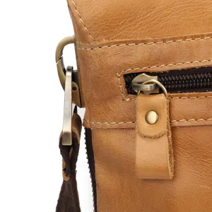 Men's genuine leather shoulder bag detail shot, vintage metal hardware and sturdy zipper.