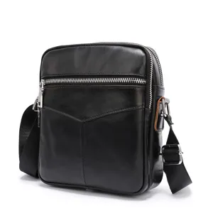 Men's black genuine leather crossbody bag detail view with front zipper pocket and strap.