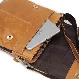 Men's genuine leather crossbody shoulder bag detail view showing large capacity interior.