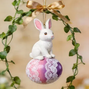 Easter bunny ornament with decorative egg and gold bow, perfect for holiday home and car decor.