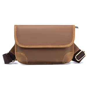 Detailed view of brown vintage crazy horse leather men cross-body bag with durable shoulder strap.