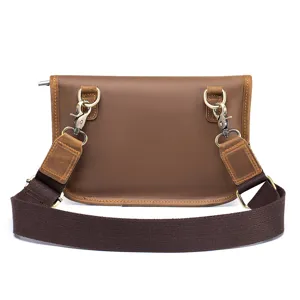 Detail view of brown crazy horse leather men shoulder bag back strap metal hardware hooks