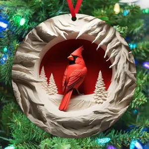 Close-up detail of the circular Christmas tree hanging ornament featuring a winter cardinal design.