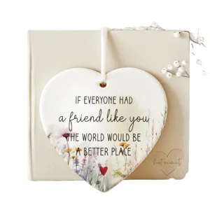 Ceramic heart friendship ornament with floral design and motivational quote for best friends.