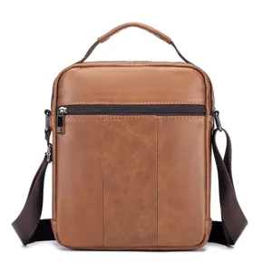 Brown leather vertical mens crossbody bag, stylish business shoulder bag for daily use.