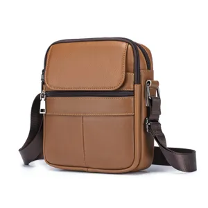 Brown leather men shoulder bag detail showing multi pocket design and metal zipper hardware.