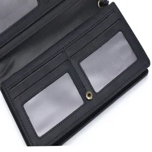 Black leather long wallet detail shot with multiple card slots and clear ID windows.