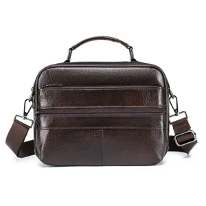 Leather messenger bag detail showcasing the texture, zippers, and sturdy top handle.