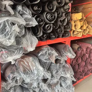 Genuine leather rolls warehouse storage display for premium business men bag making main view.