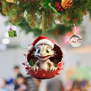 Close-up detail view of the cute cartoon baby dragon acrylic Christmas ornament hanging on tree.
