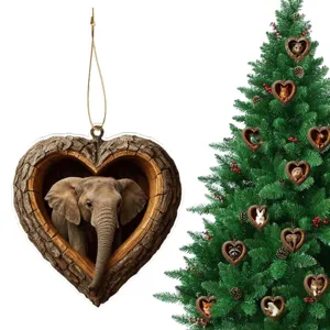 Christmas tree hanging ornament featuring a cute elephant inside a rustic wooden heart frame.