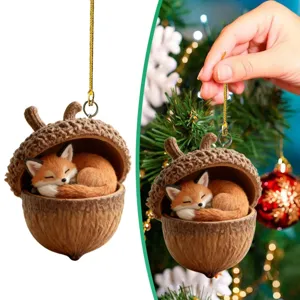 Detailed view of the cute sleeping fox figurine inside a natural acorn shell Christmas ornament.
